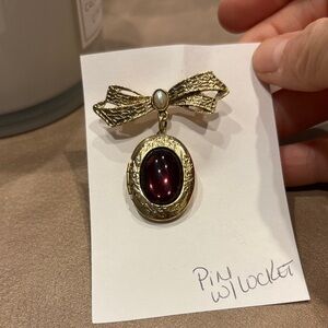 Woman’s Gold and Red Bow Locket Pin